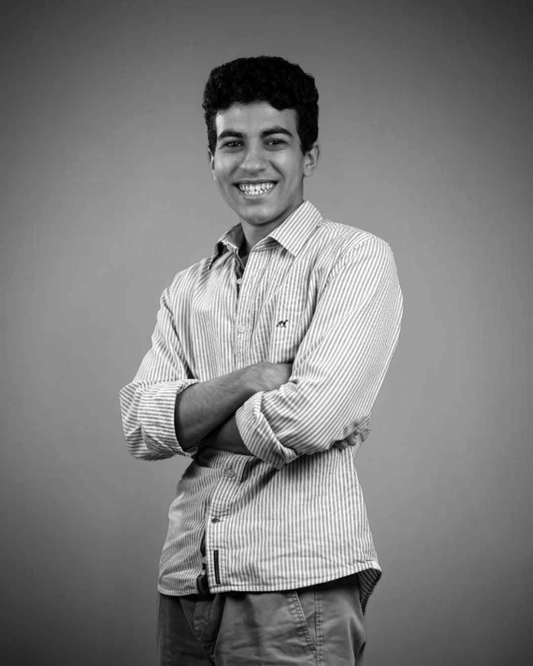 Aziiz — كبير المحرّرين · Senior Editor, Optiiimum